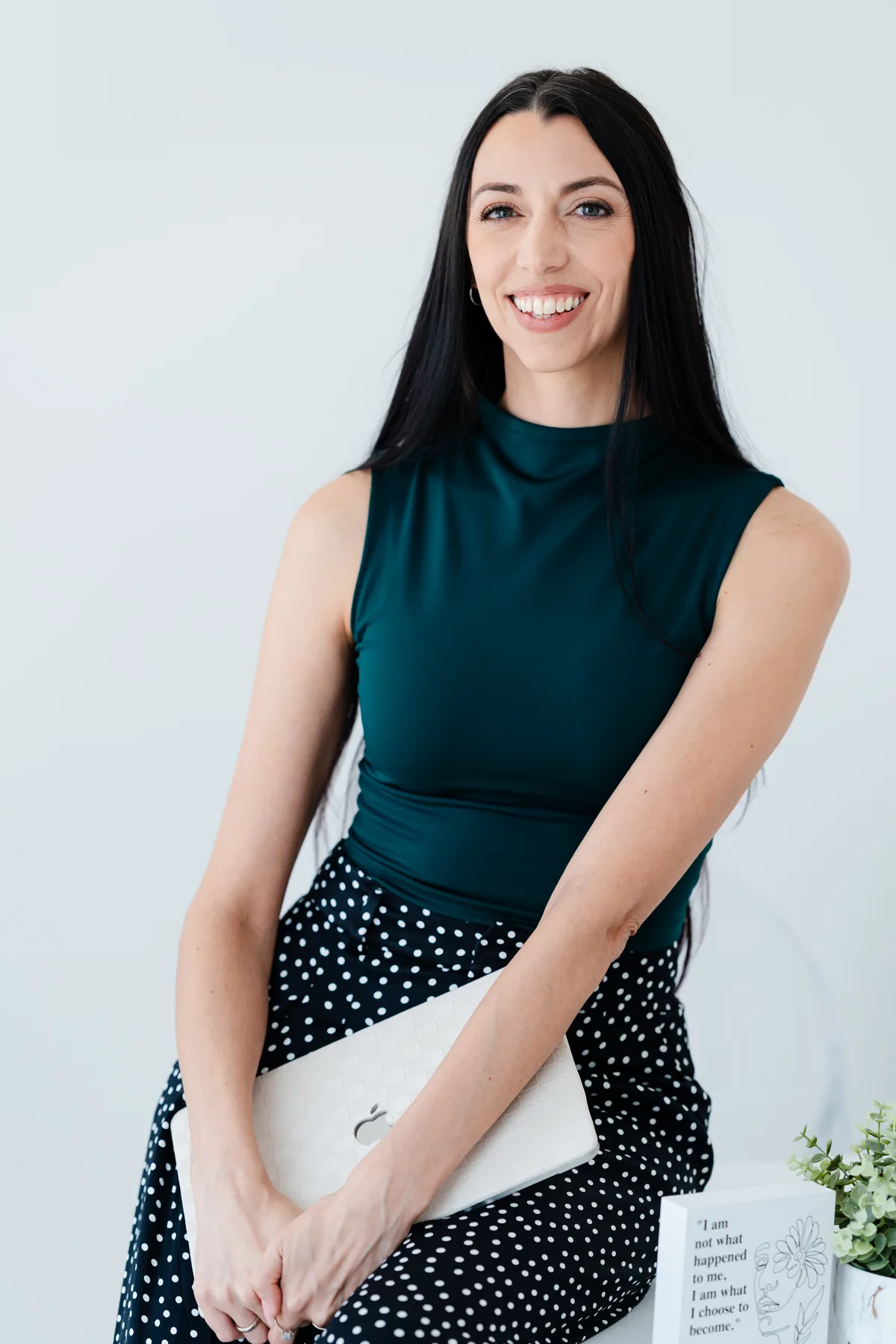 Robyn Sevigny, LMFT, in a dark teal top, smiling warmly at the camera